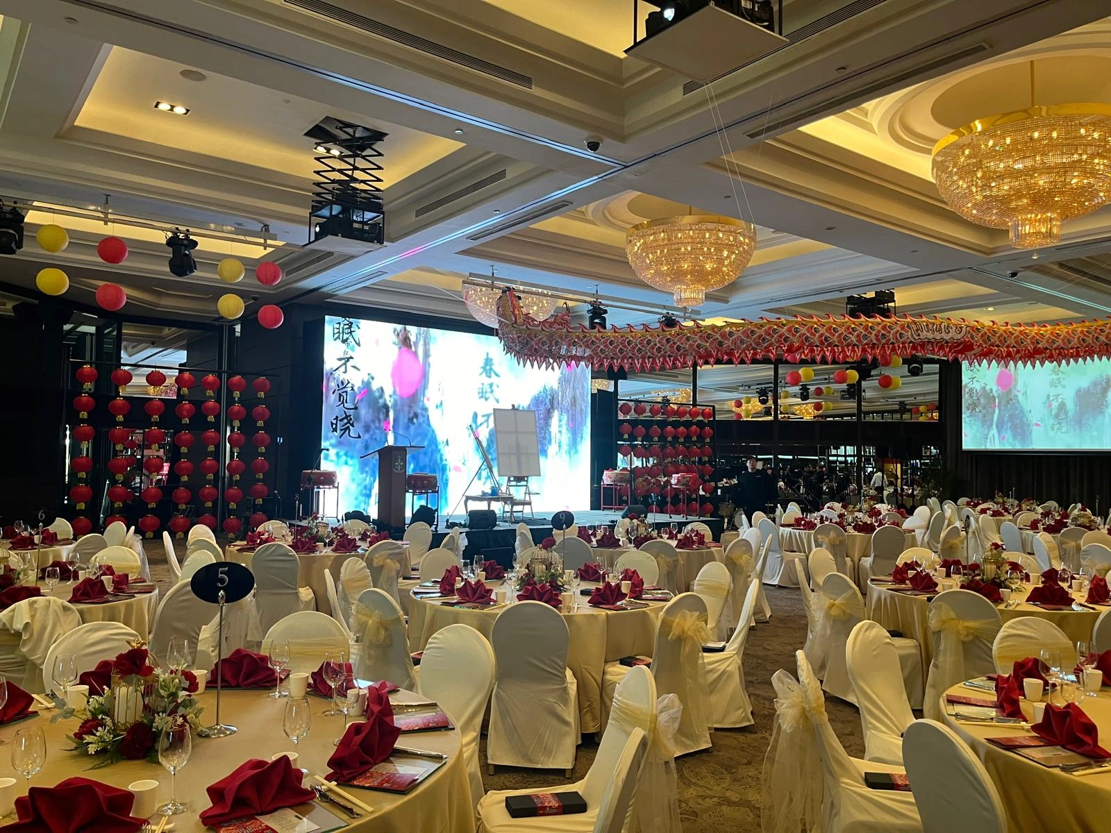 Festive Gala Dinner Ballroom with LED Screen Backdrop