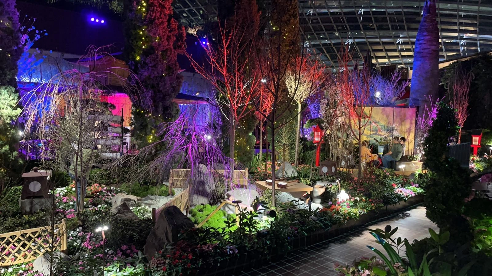 Themed Botanical Floral Display with Accent Lighting