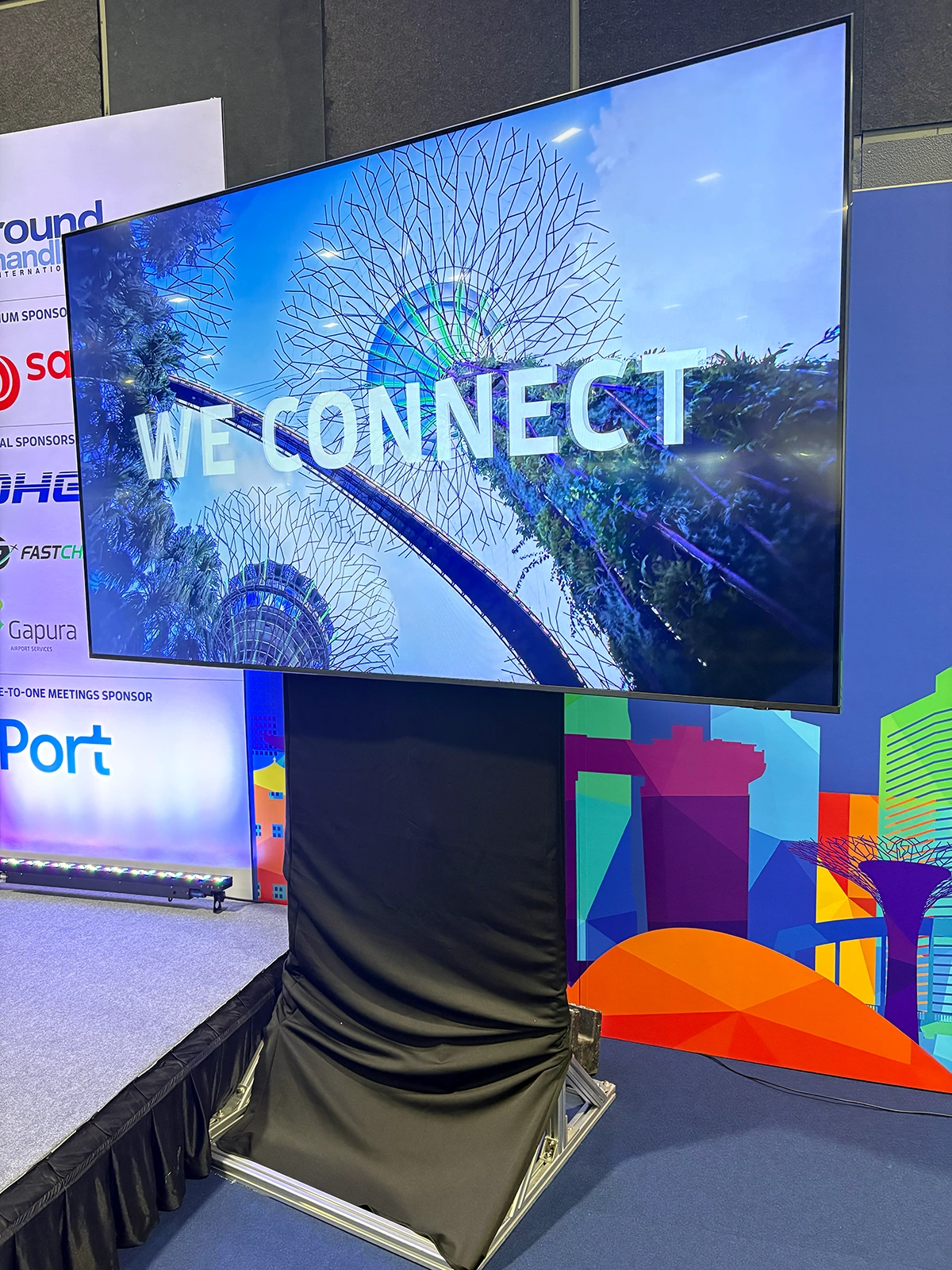 Large-Format Event Screen on Draped Stage Stand