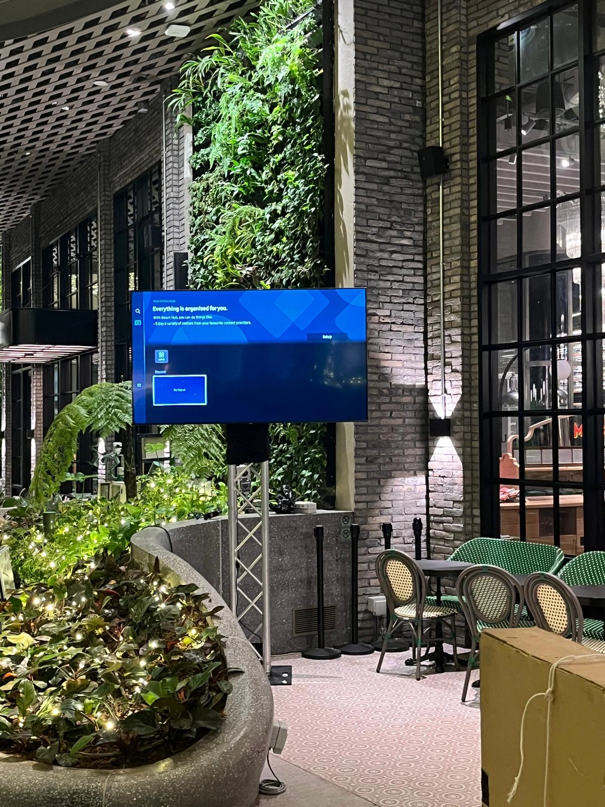 Truss-Mounted Display Screen in Garden Event Space